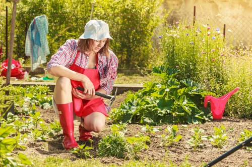Gardener preparing a transparent pricing quote for Bethnal Green garden clearance